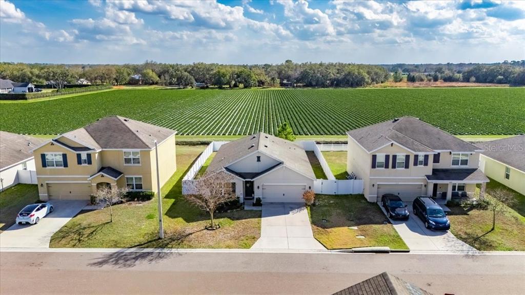 3246 South Northview Road Plant City, FL 33566 - Photo 44 of 57 an aerial view of a house with swimming pool and a yard