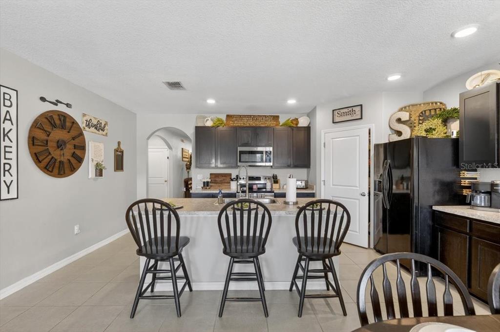 3246 South Northview Road Plant City, FL 33566 - Photo 9 of 57 a view of a dining room with furniture and chandelier