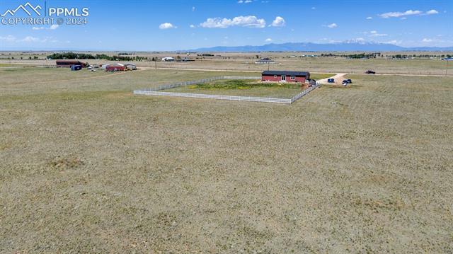 5929 North Log Road Calhan, CO 80808 - Photo 36 of 41 Birds eye view of property with a rural view and a mountain view