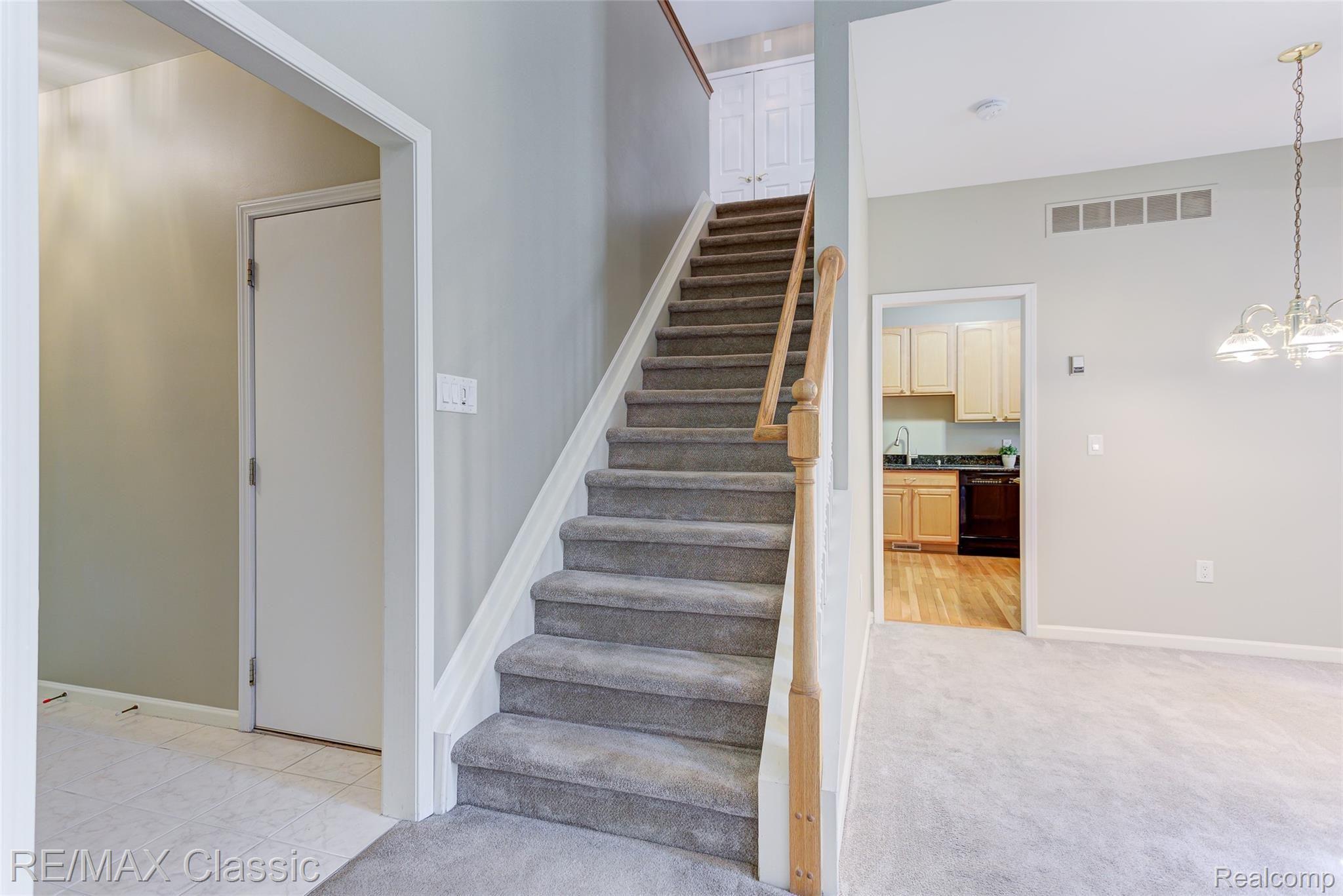 41620 Mitchell Road Novi, MI 48377 - Photo 14 of 40 from the ceramic tile entry to the stairway to the upper level