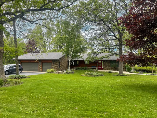 a view of a house with a yard porch and sitting area
