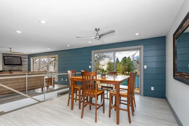 a view of a dining room with furniture window and wooden floor
