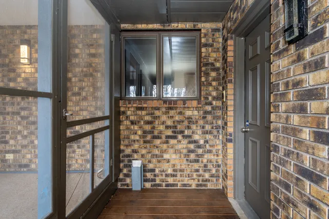 a bedroom with a bed and a table