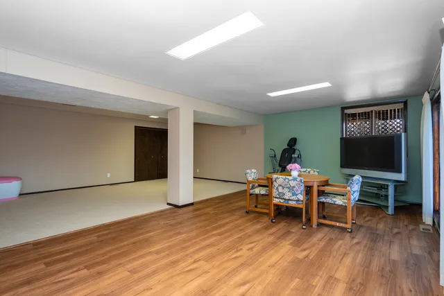 a bedroom with a bed and a chair