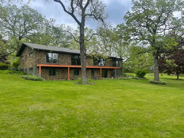 a view of a chairs and table in the patio