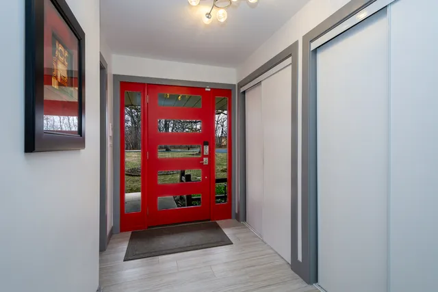 a dining room with furniture and wooden floor