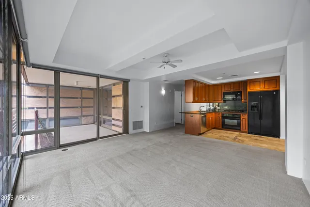 an empty room with furniture and a fireplace