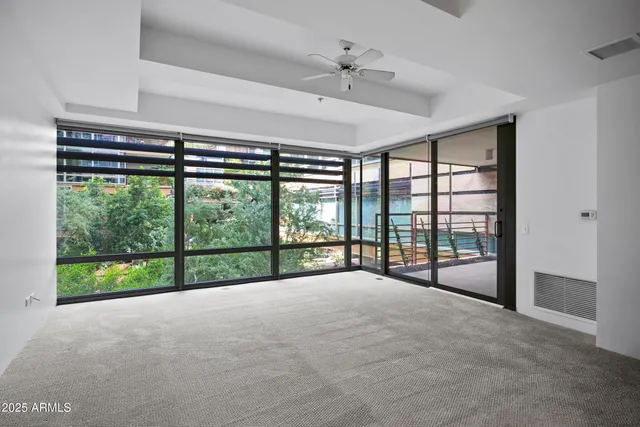 a view of an empty room with a large window