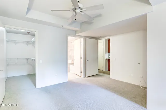a view of empty room with ceiling fan