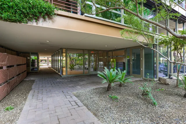 a view of a porch with a bench and table