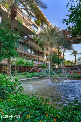 a front view of a building with outdoor seating