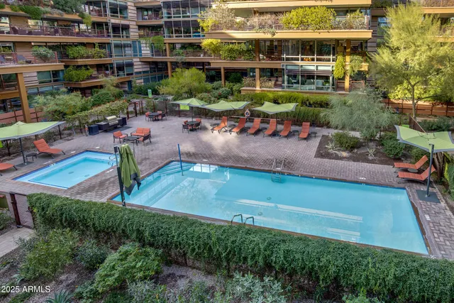 a view of a backyard with sitting area