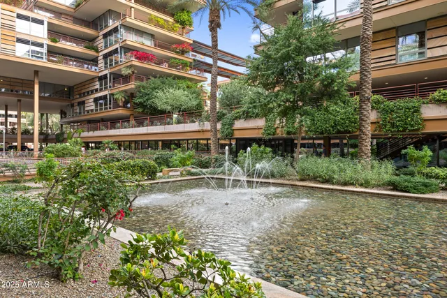 a balcony view with a seating space