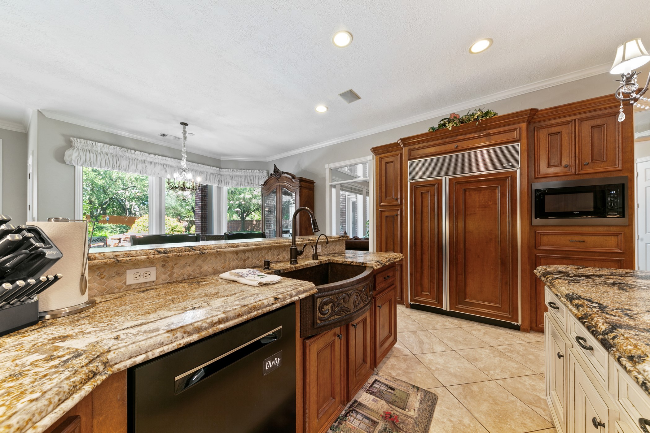 13915 Springmint Drive Cypress, TX 77429 - Photo 12 of 43 a kitchen with granite countertop a sink stove and refrigerator