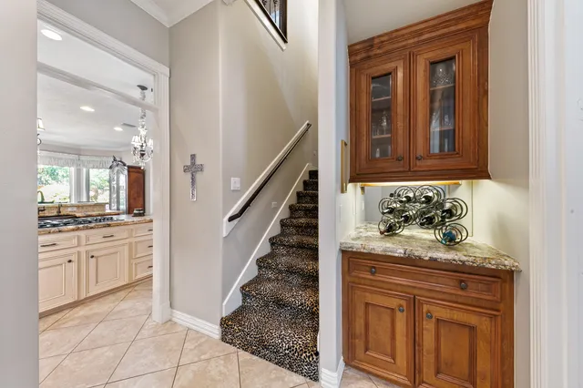 a spacious bathroom with a granite countertop sink mirror and vanity