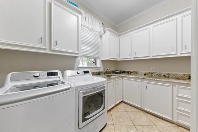 a living room with furniture flat screen tv and fireplace