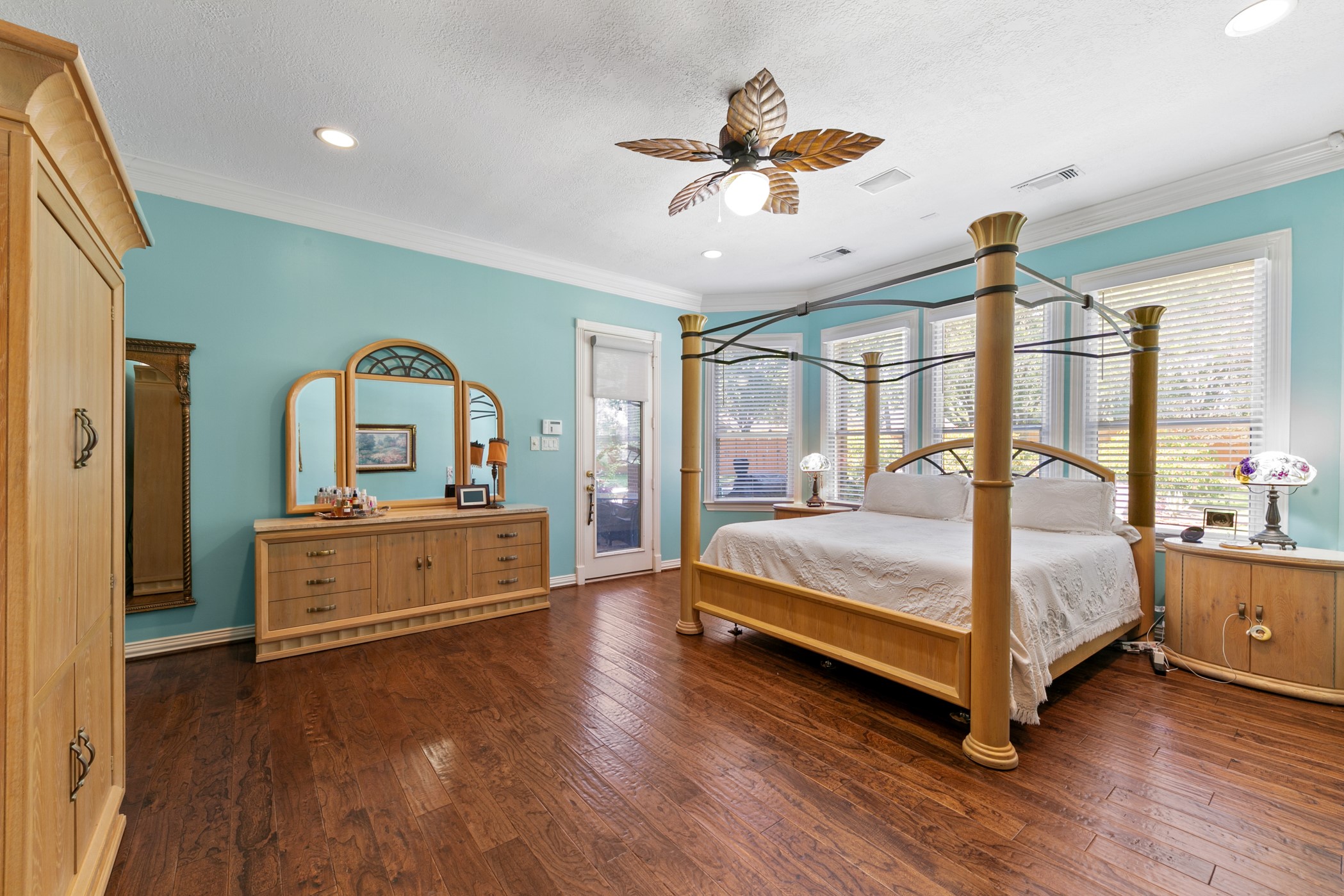 13915 Springmint Drive Cypress, TX 77429 - Photo 20 of 43 Warm wood floors and elegant crown molding pair beautifully with abundant natural light streaming through expansive windows
