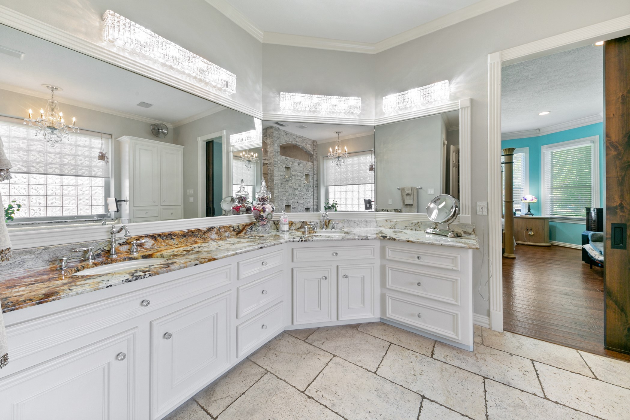 13915 Springmint Drive Cypress, TX 77429 - Photo 23 of 43 a spacious bathroom with a granite countertop sink mirror and vanity