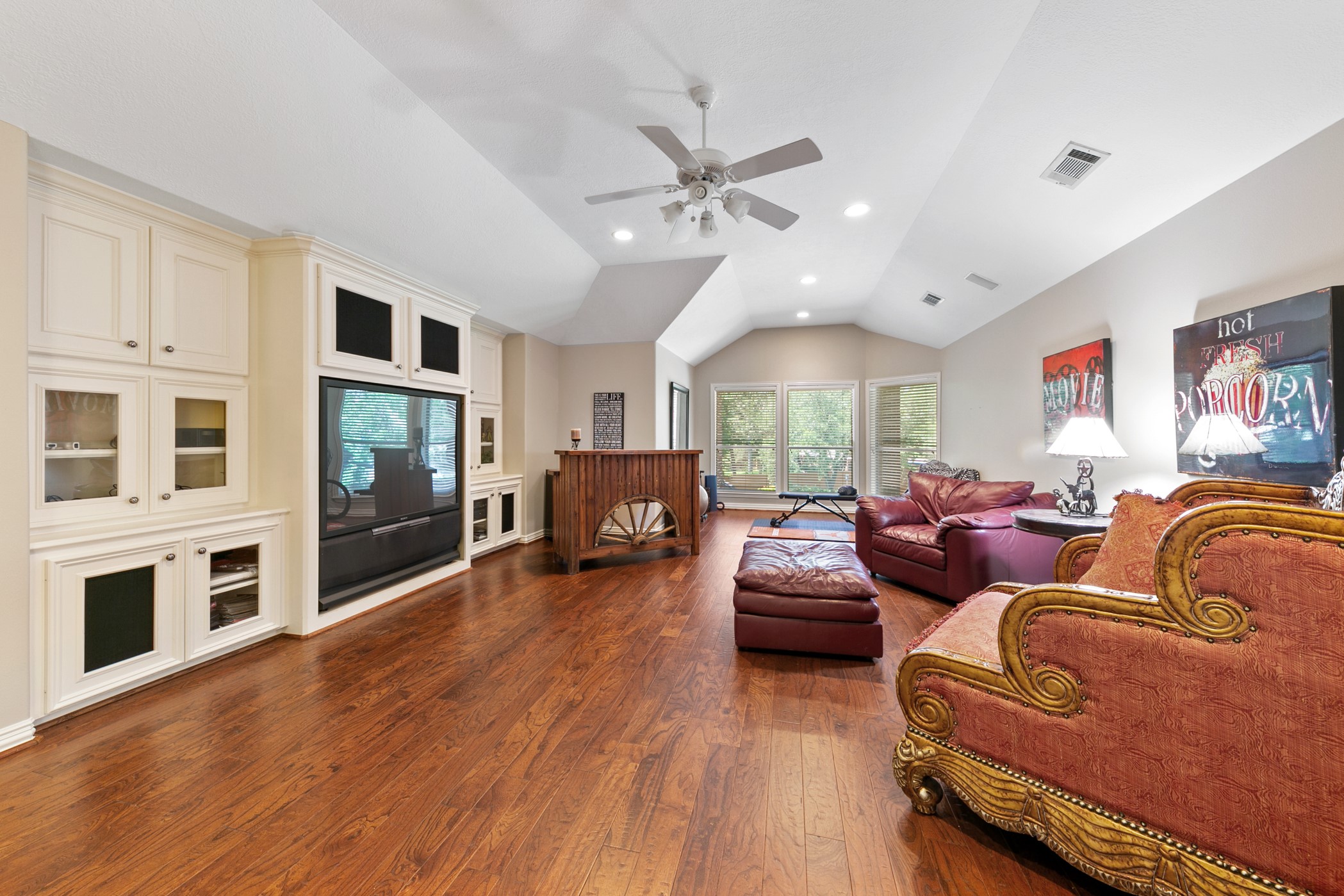 13915 Springmint Drive Cypress, TX 77429 - Photo 25 of 43 a living room with furniture flat screen tv and fireplace