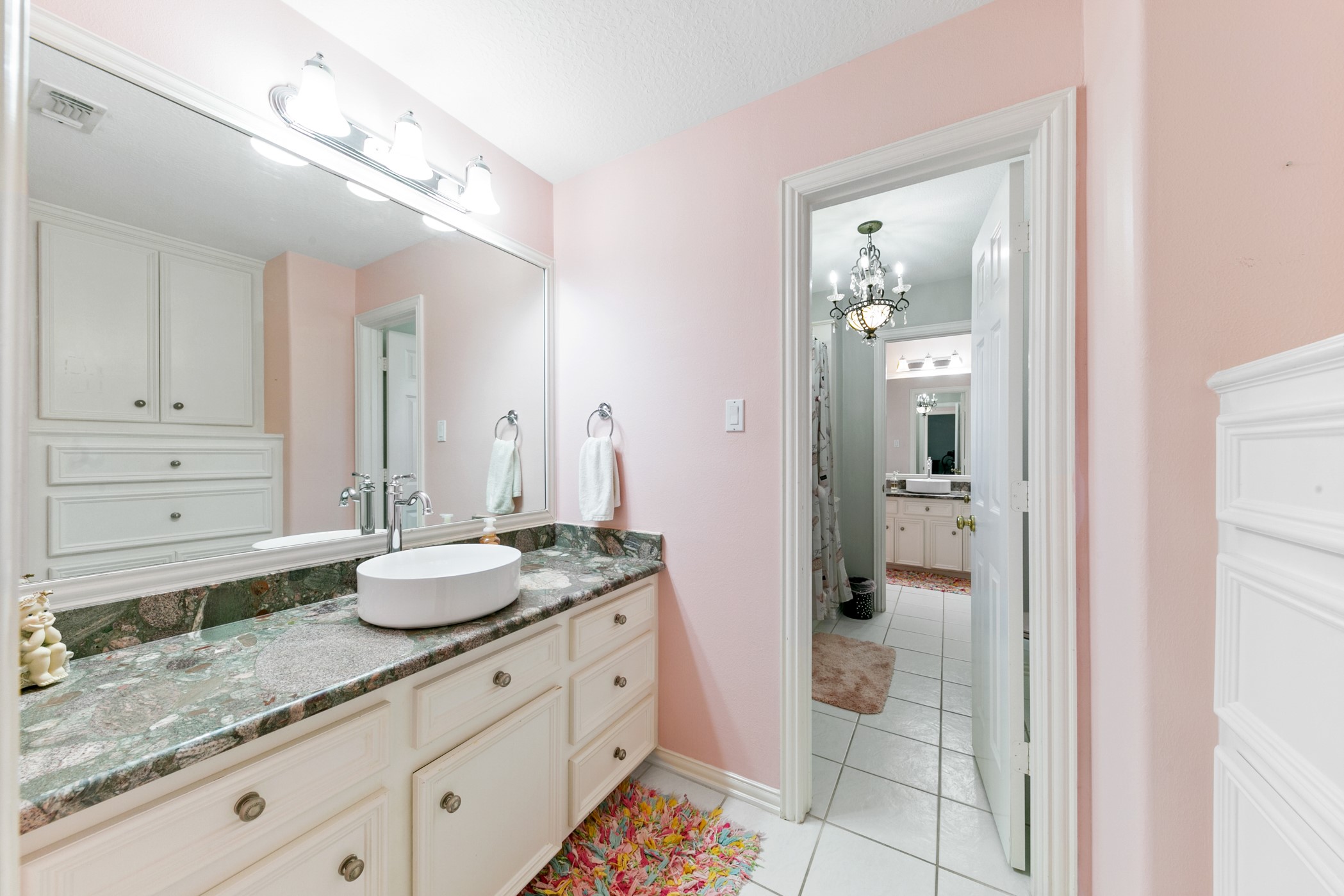 13915 Springmint Drive Cypress, TX 77429 - Photo 30 of 43 a spacious bathroom with a granite countertop sink and a mirror
