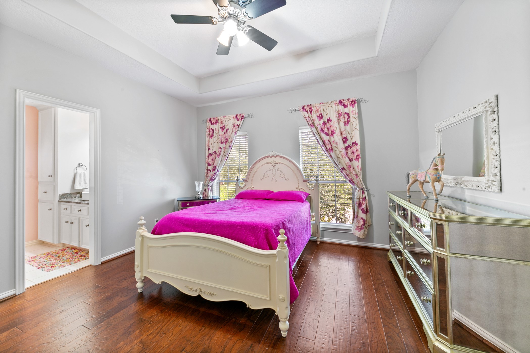 13915 Springmint Drive Cypress, TX 77429 - Photo 31 of 43 a bedroom with a bed and a chandelier