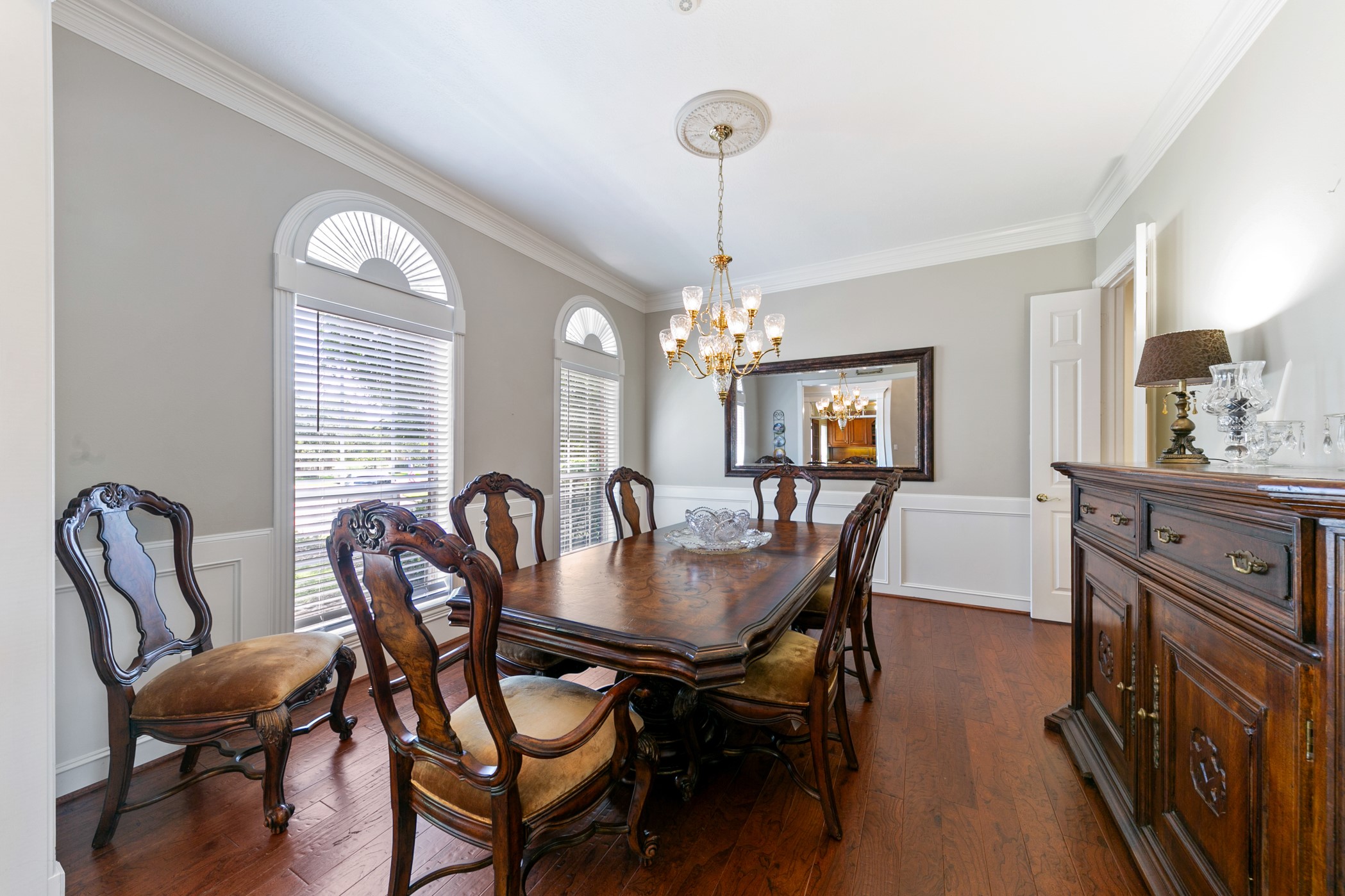 13915 Springmint Drive Cypress, TX 77429 - Photo 4 of 43 a dining room with furniture a chandelier and wooden floor