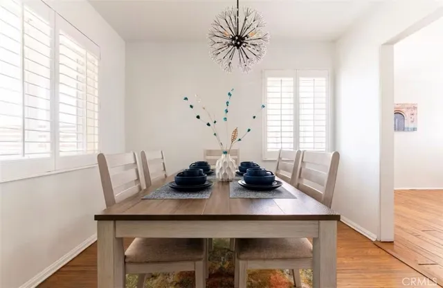 a view of a dining room with furniture and window