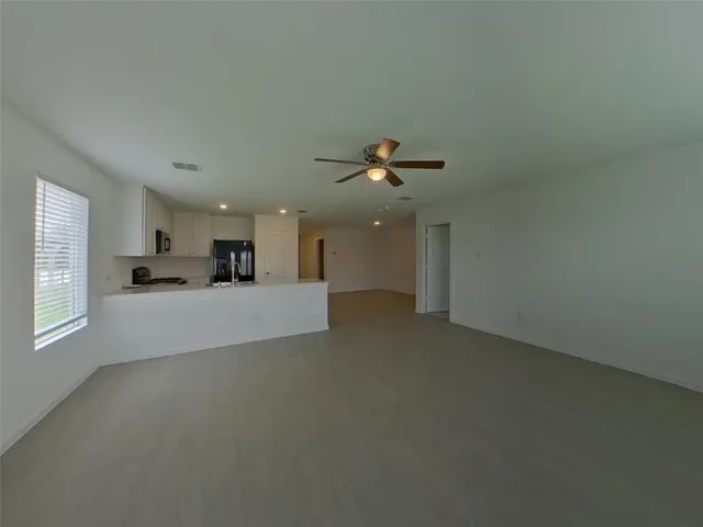 a view of a livingroom and a kitchen