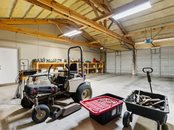 a view of a garage with parked cars