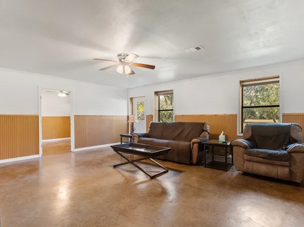 a living room with furniture and a window