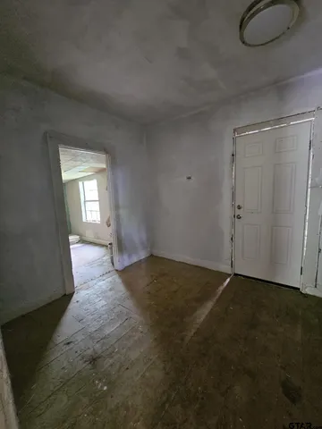 a view of an empty room and window