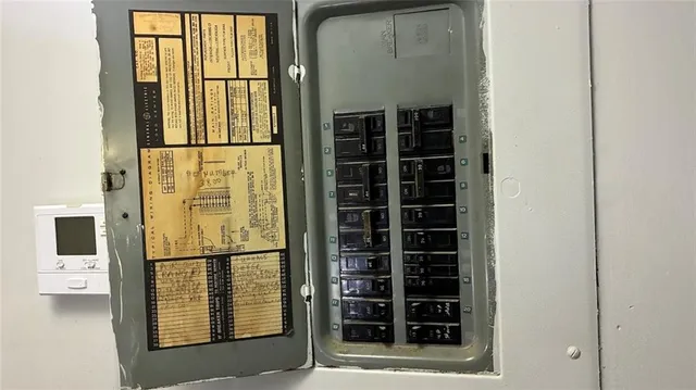 a small bathroom with a granite countertop toilet and a sink