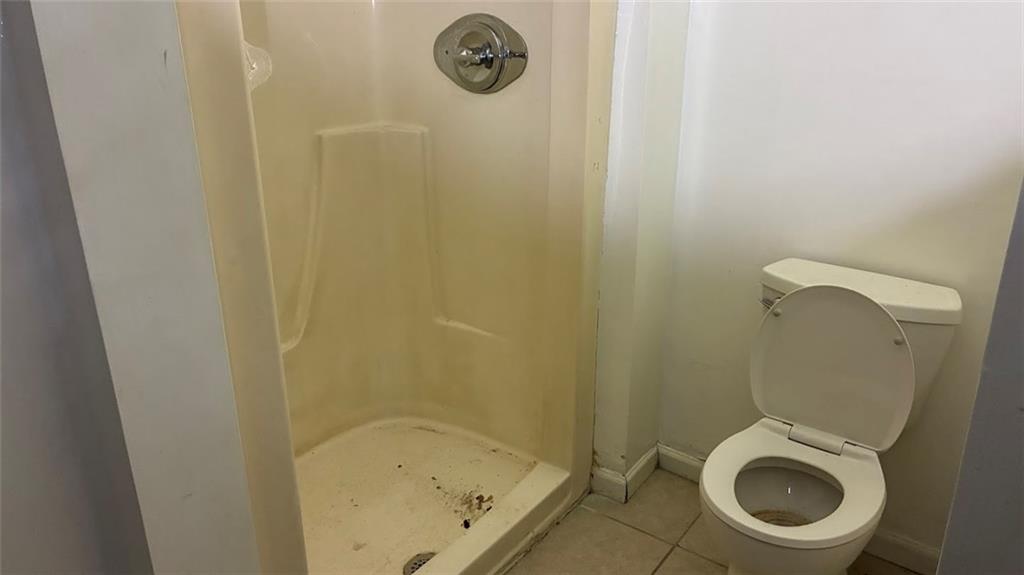 3800 Kensingwood Trace Decatur, GA 30032 - Photo 22 of 58 a small bathroom with a granite countertop toilet and a sink