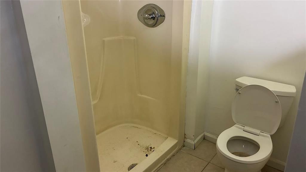 3800 Kensingwood Trace Decatur, GA 30032 - Photo 23 of 58 a small bathroom with a granite countertop toilet and a sink
