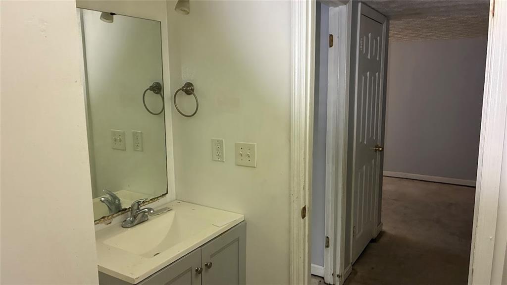 3800 Kensingwood Trace Decatur, GA 30032 - Photo 26 of 58 a bathroom with a granite countertop shower and a sink