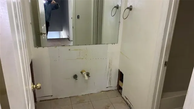 a bathroom with a toilet and a sink