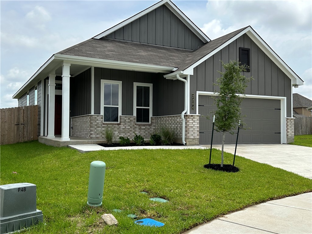 2204 Johnny Lyon Court Bryan, TX 77807 - Photo 1 of 10 a front view of a house with a garden