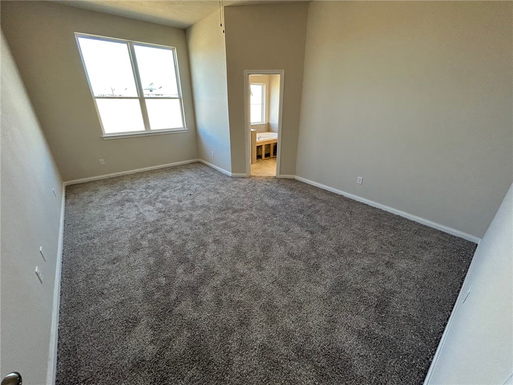 2204 Johnny Lyon Court Bryan, TX 77807 - Photo 6 of 10 an empty room with a window