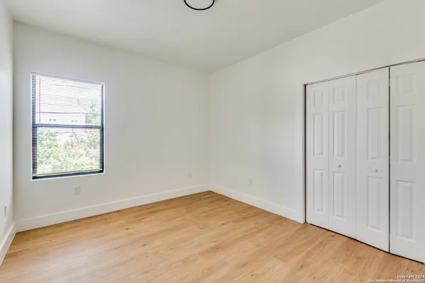 an empty room with a empty space and a window