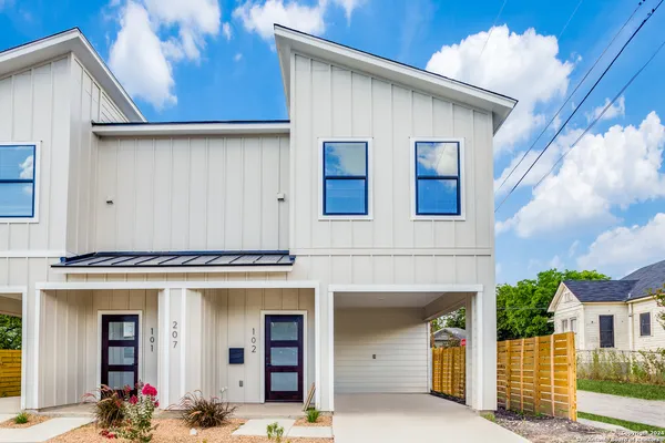 a front view of a house with yard
