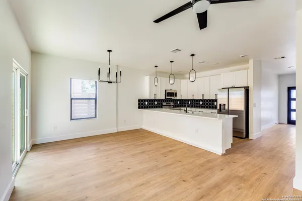a view of kitchen with refrigerator sink and microwave