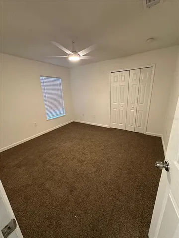 a spacious bathroom with a double vanity sink and a mirror