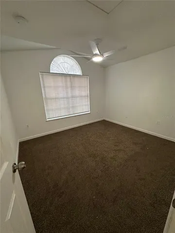 a bathroom with a tub a sink and a mirror
