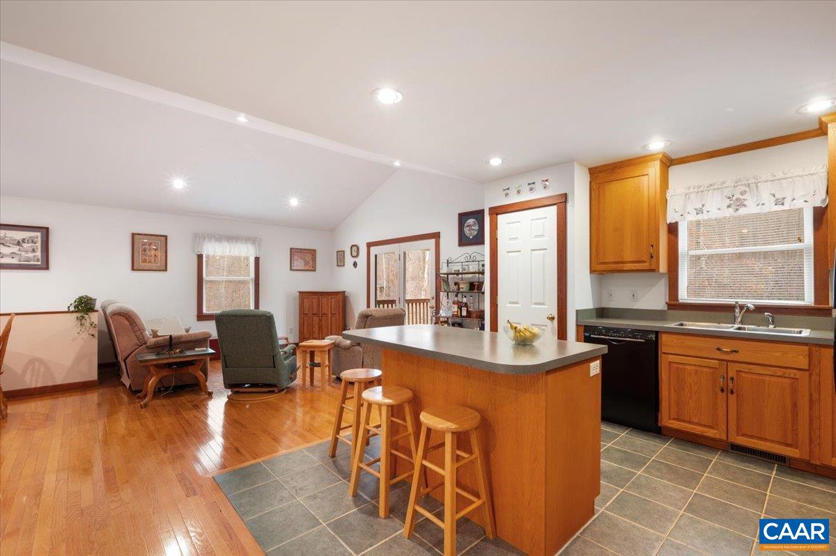 1411 Hill Hollow Road Faber, VA 22938 - Photo 11 of 50 a kitchen with stainless steel appliances granite countertop a sink and a living room view