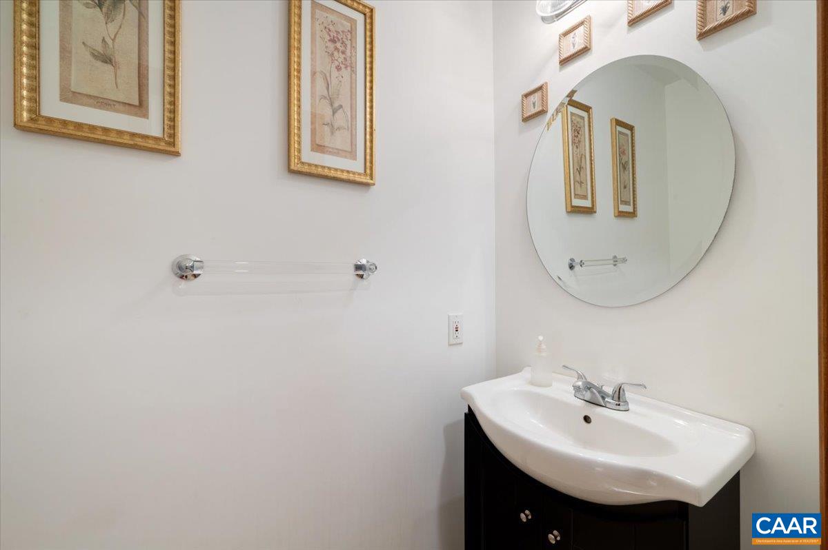 1411 Hill Hollow Road Faber, VA 22938 - Photo 13 of 50 a bathroom with a sink and a mirror