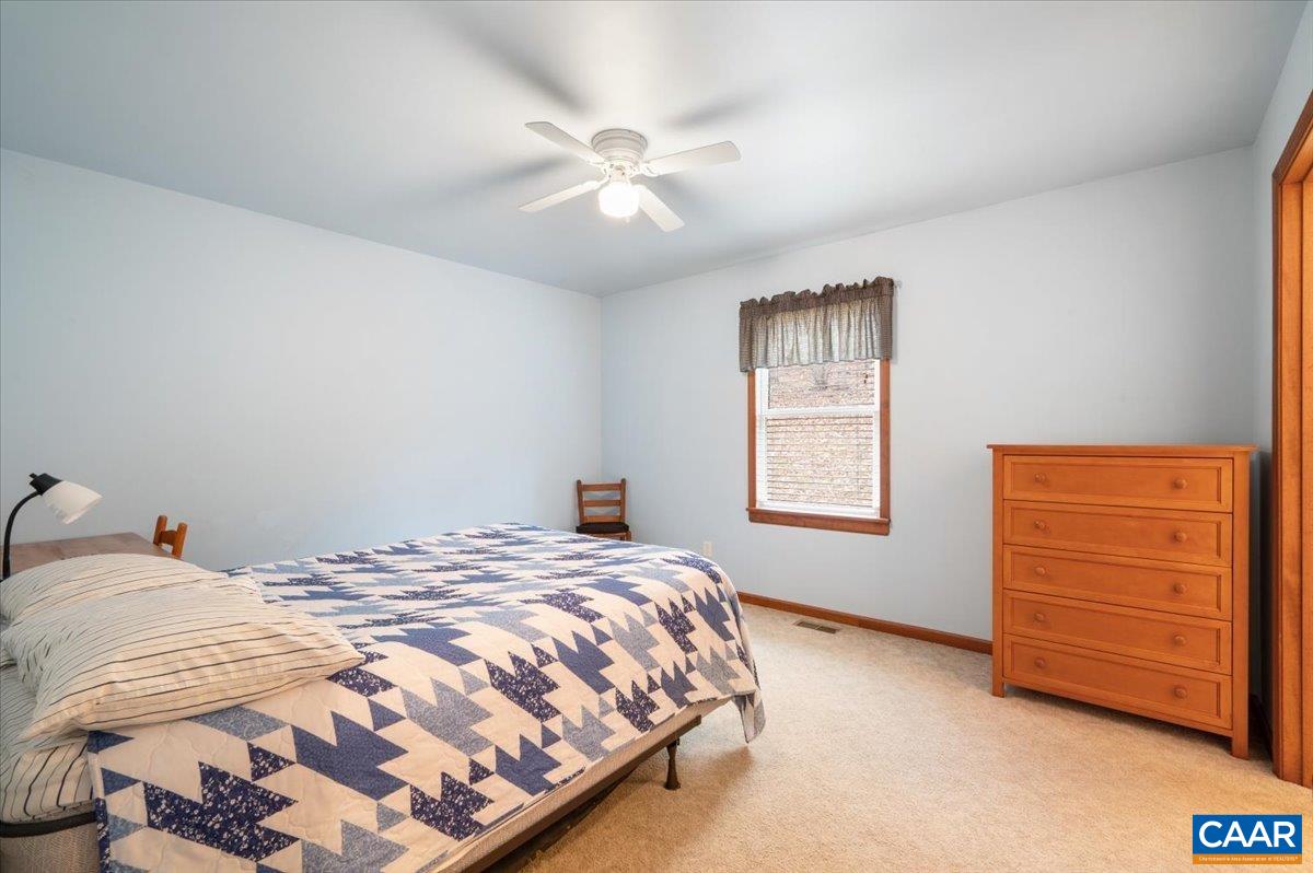 1411 Hill Hollow Road Faber, VA 22938 - Photo 14 of 50 a bedroom with a bed and a window