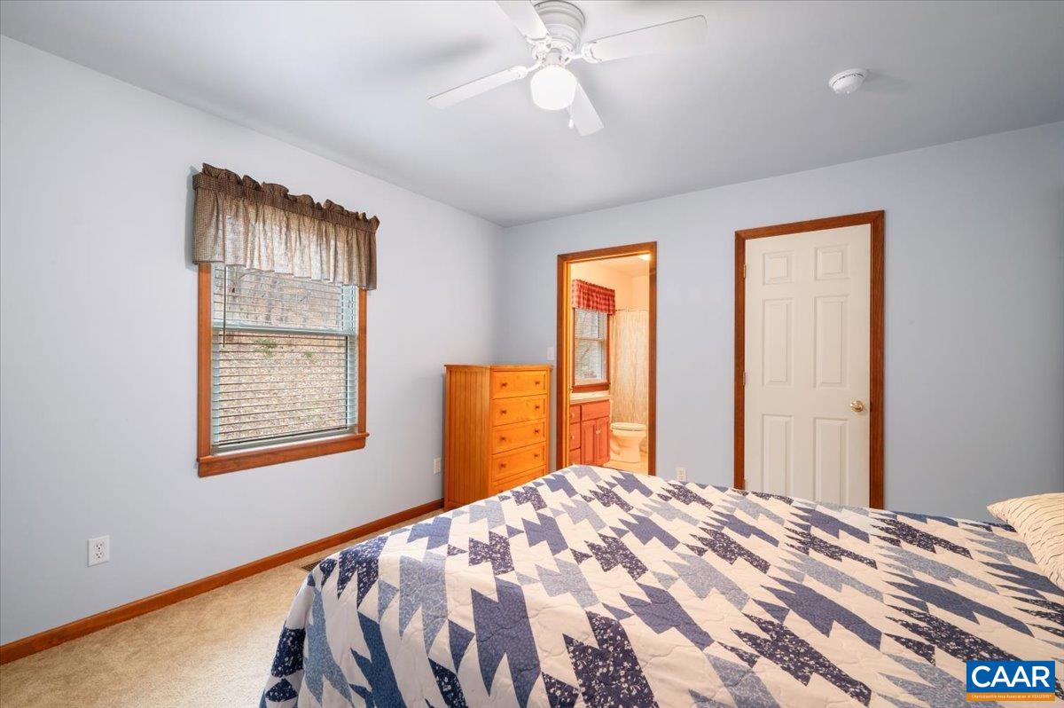 1411 Hill Hollow Road Faber, VA 22938 - Photo 15 of 50 a bedroom with a bed and a window