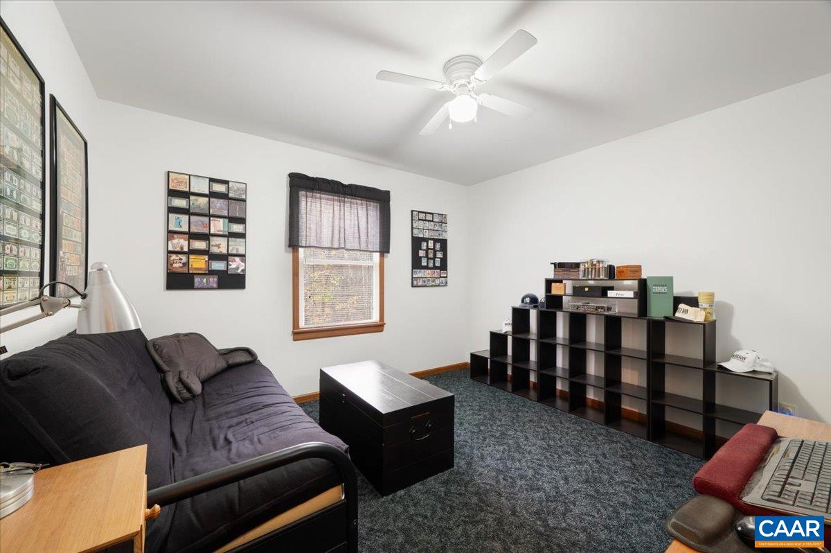 1411 Hill Hollow Road Faber, VA 22938 - Photo 18 of 50 a living room with furniture a ceiling fan and a window