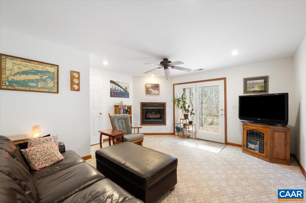 1411 Hill Hollow Road Faber, VA 22938 - Photo 21 of 50 a living room with furniture and a flat screen tv