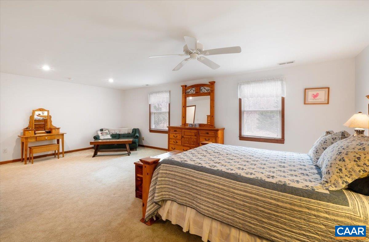 1411 Hill Hollow Road Faber, VA 22938 - Photo 25 of 50 a bedroom with furniture and a bed